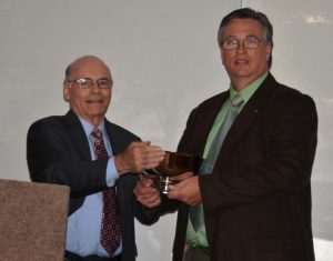 Dr. Max l. Porter, Chairman of TMS's Research Committee presents the 2012 Scalzi Research Award to Dr. McGinley at TMS's Awards Luncheon in Greenville, South Carolina on September 15, 2012.